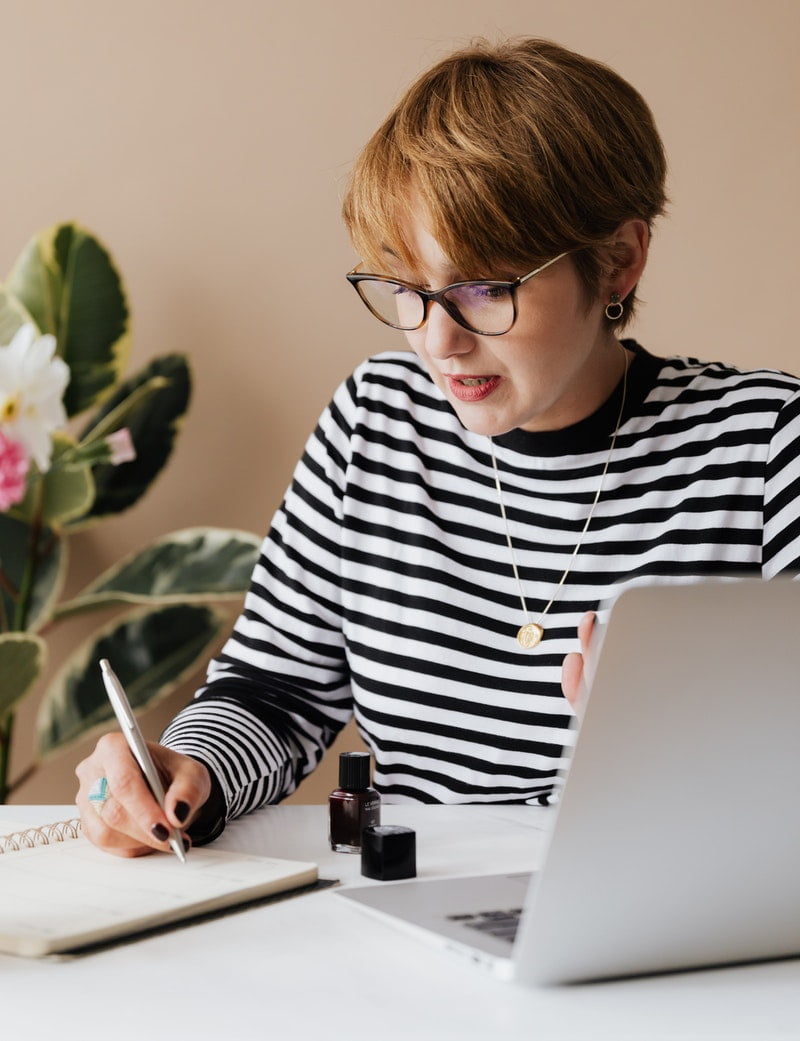 Female entrepreneur working on laptop